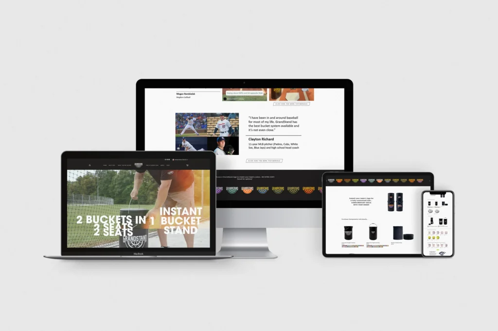 Responsive web design mockup of the GrandStand baseball equipment e-commerce website displayed on a desktop monitor, laptop, tablet, and smartphone — showing the homepage hero with '2 Buckets in 1, 2 Seats — Instant Bucket Stand' and a testimonial from MLB pitcher Clayton Richard